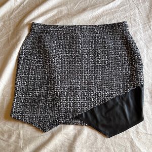 Tweed mini skirt with black leather detail